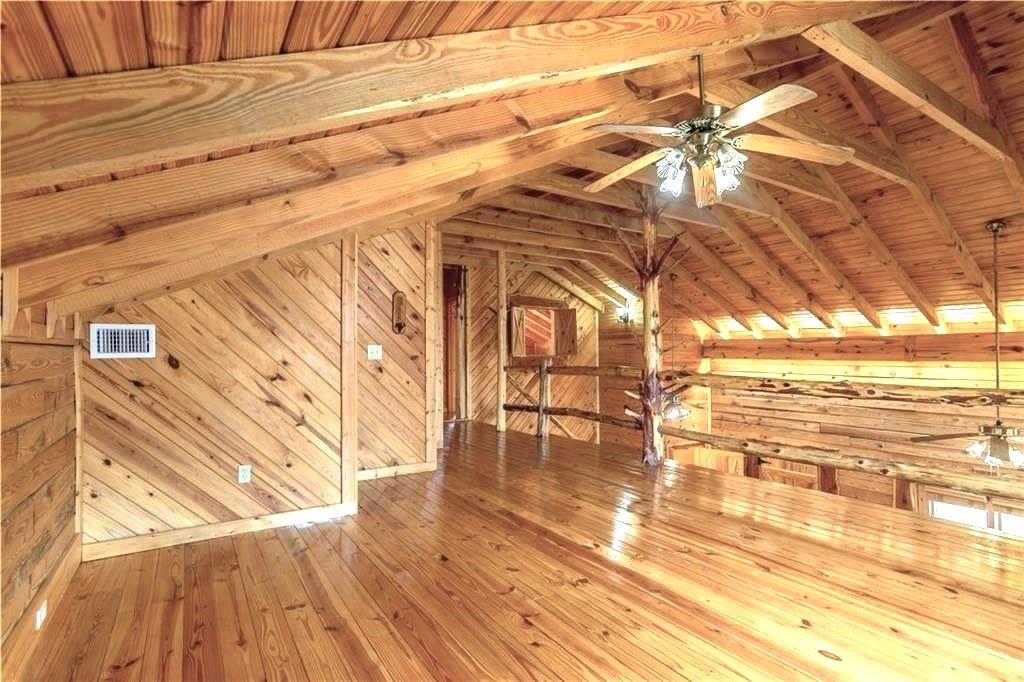 647 Knight Bottom Road Fairmount, GA 30139 - Photo 24 of 62 a view of an empty room with wooden floor and a window