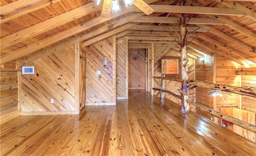 647 Knight Bottom Road Fairmount, GA 30139 - Photo 25 of 62 a view of a porch with wooden floor and fence