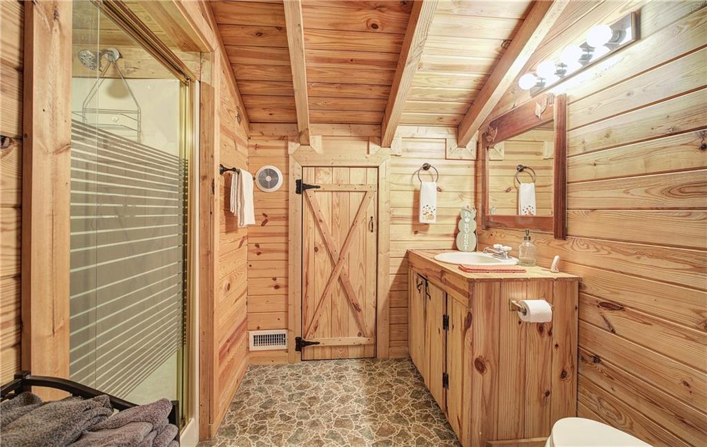 647 Knight Bottom Road Fairmount, GA 30139 - Photo 26 of 62 a bathroom with a sink and mirror