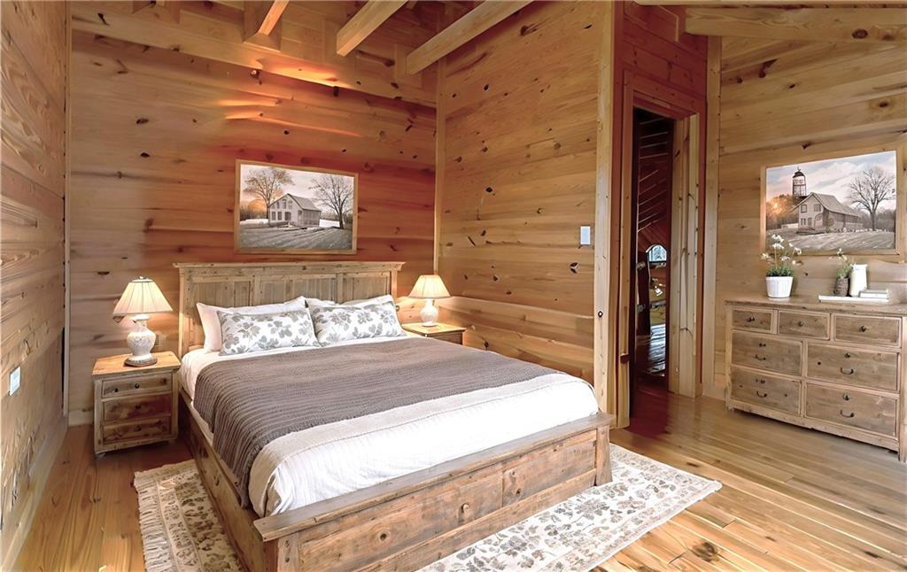 647 Knight Bottom Road Fairmount, GA 30139 - Photo 28 of 62 a bed sitting in a bedroom next to a window