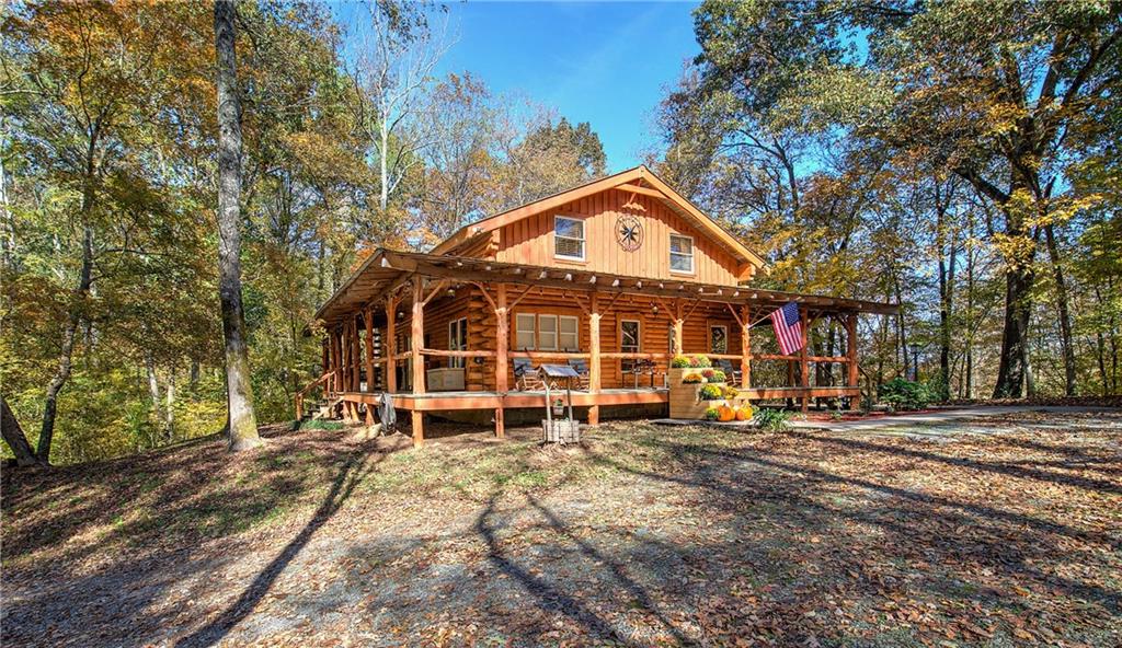 647 Knight Bottom Road Fairmount, GA 30139 - Photo 3 of 62 a front view of a house with a yard