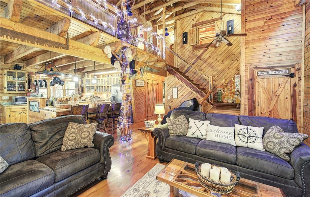 647 Knight Bottom Road Fairmount, GA 30139 - Photo 35 of 62 a living room with furniture and a wooden floor