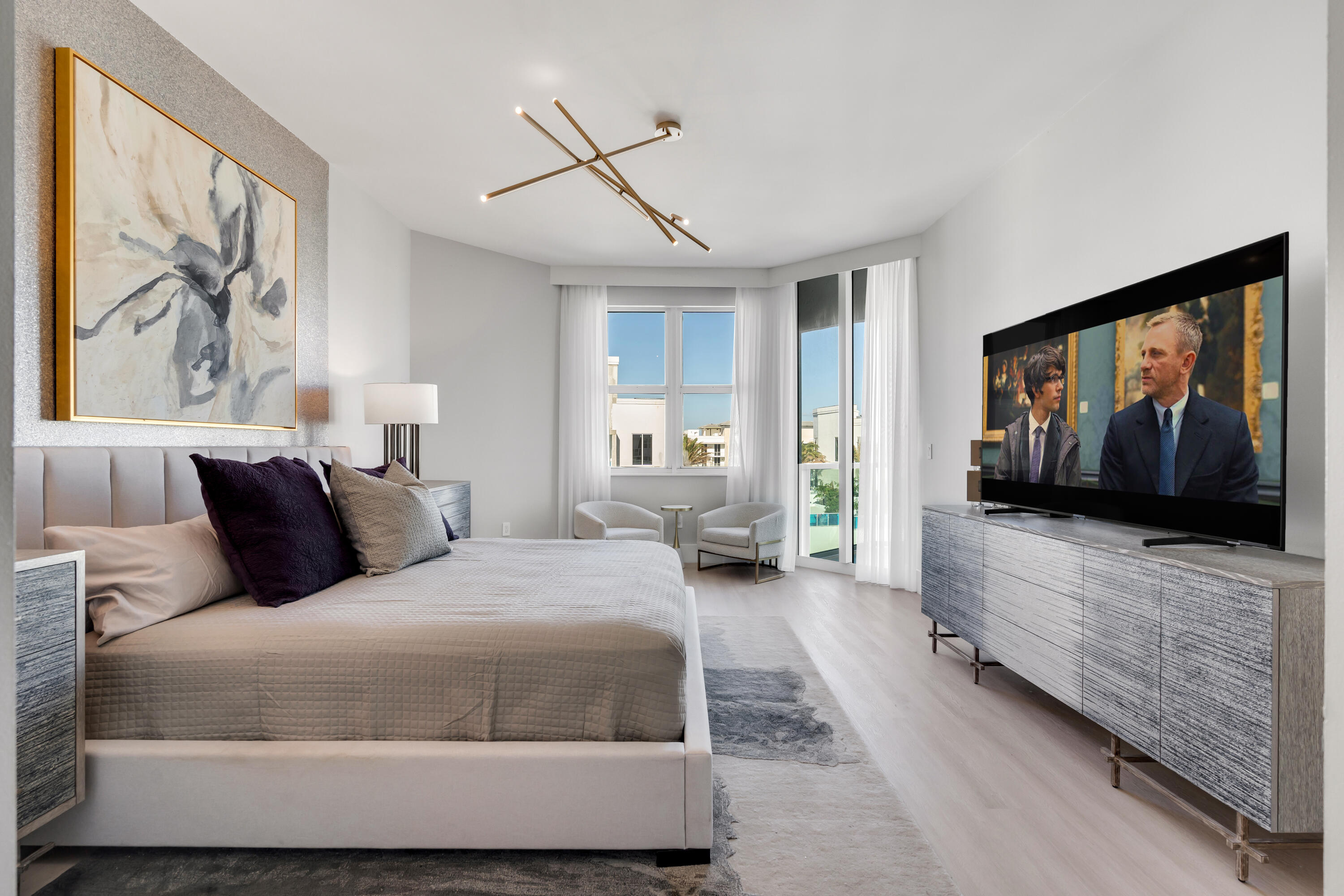 500 Southeast Mizner Boulevard, Unit A902 Boca Raton, FL 33432 - Photo 6 of 23 a living room with furniture and a flat screen tv