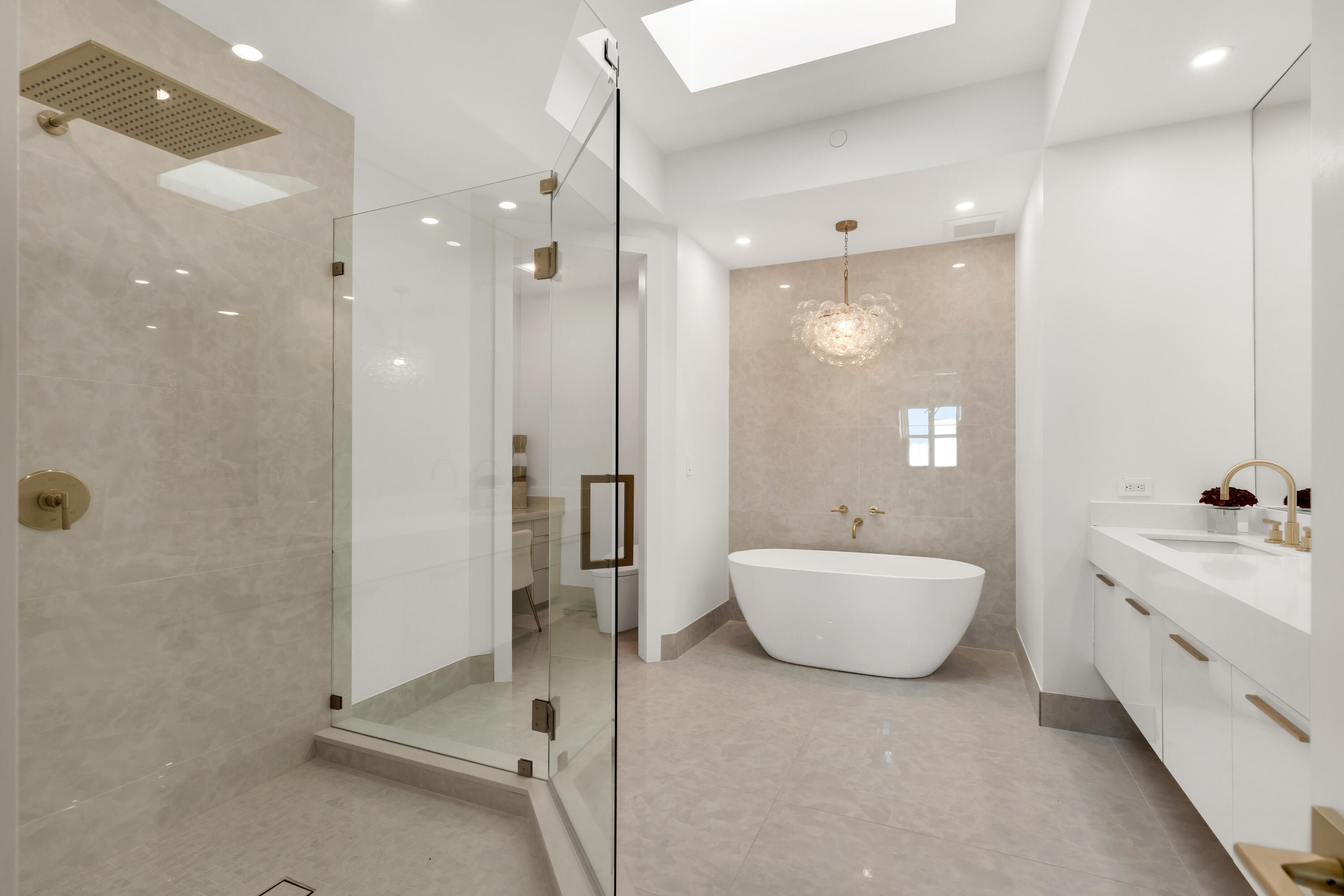 500 Southeast Mizner Boulevard, Unit A902 Boca Raton, FL 33432 - Photo 7 of 23 a bathroom with a tub sink a mirror and a shower