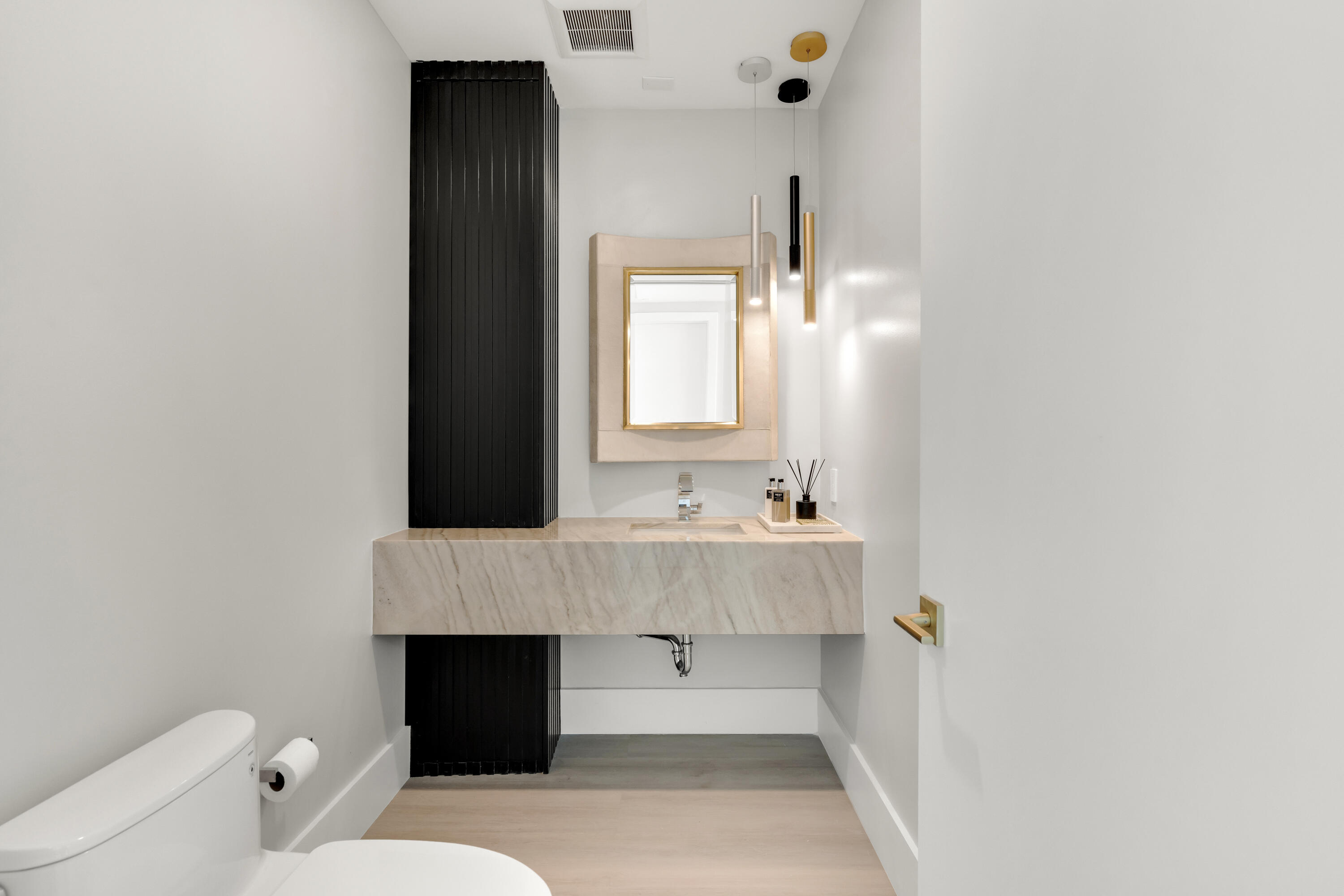 500 Southeast Mizner Boulevard, Unit A902 Boca Raton, FL 33432 - Photo 10 of 23 a bathroom with a sink a toilet and a mirror