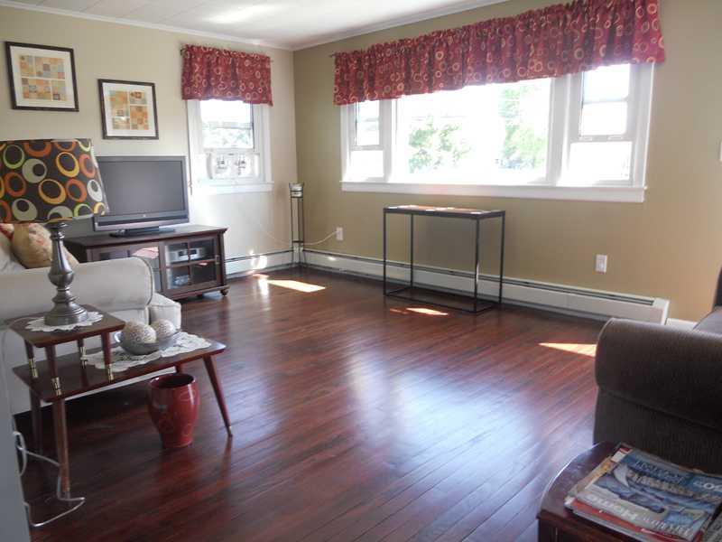 919 Spring Street Westbrook, ME 04092 - Photo 2 of 15 Living Room. Sunlit living room with...