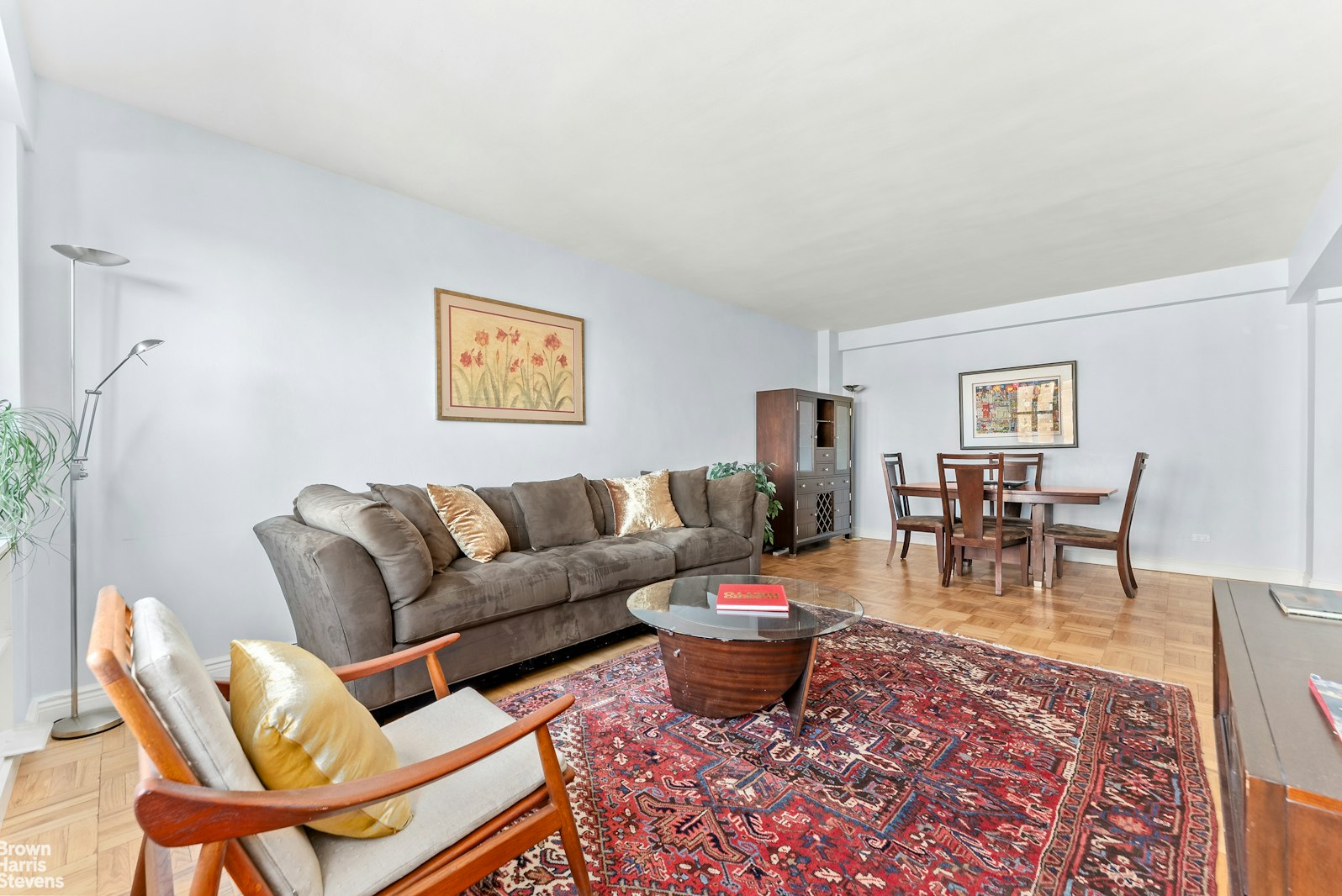 11 Riverside Drive, Unit 11VE Manhattan, NY 10023 - Photo 2 of 14 a living room with furniture and a table