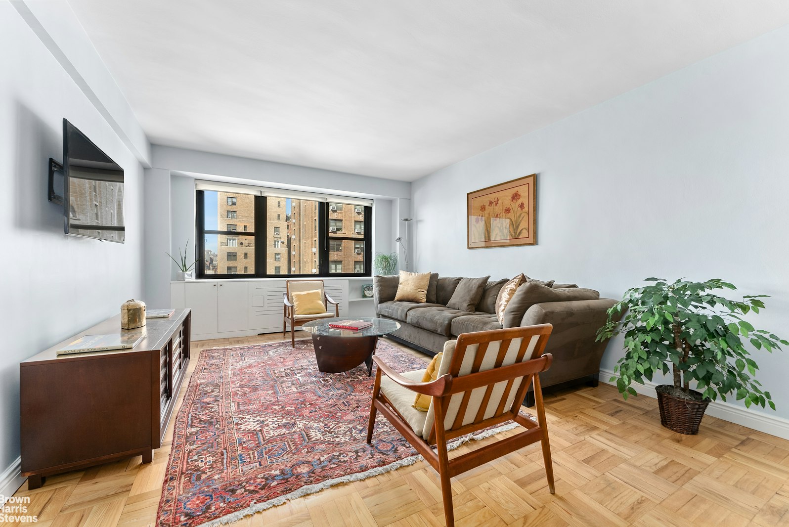 11 Riverside Drive, Unit 11VE Manhattan, NY 10023 - Photo 3 of 14 a living room with furniture and a window