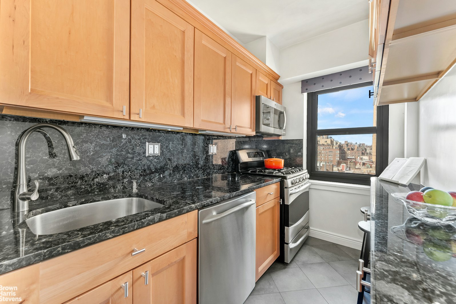 11 Riverside Drive, Unit 11VE Manhattan, NY 10023 - Photo 5 of 14 a kitchen with a sink a stove and cabinets