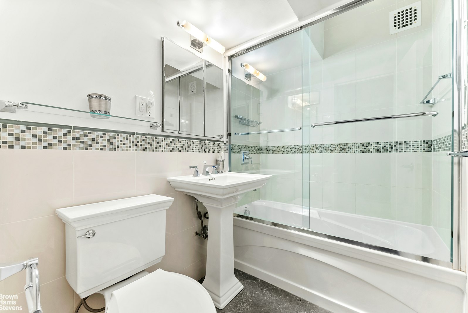 11 Riverside Drive, Unit 11VE Manhattan, NY 10023 - Photo 9 of 14 a bathroom with a sink toilet and shower
