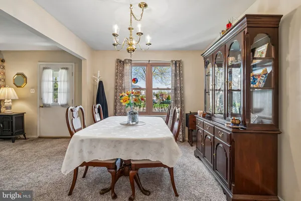 a view of a dining room with furniture and window