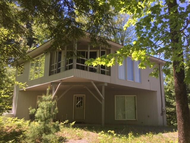 1024 Carriage Road New Portland, ME 04961 - Photo 1 of 16 springtime front view