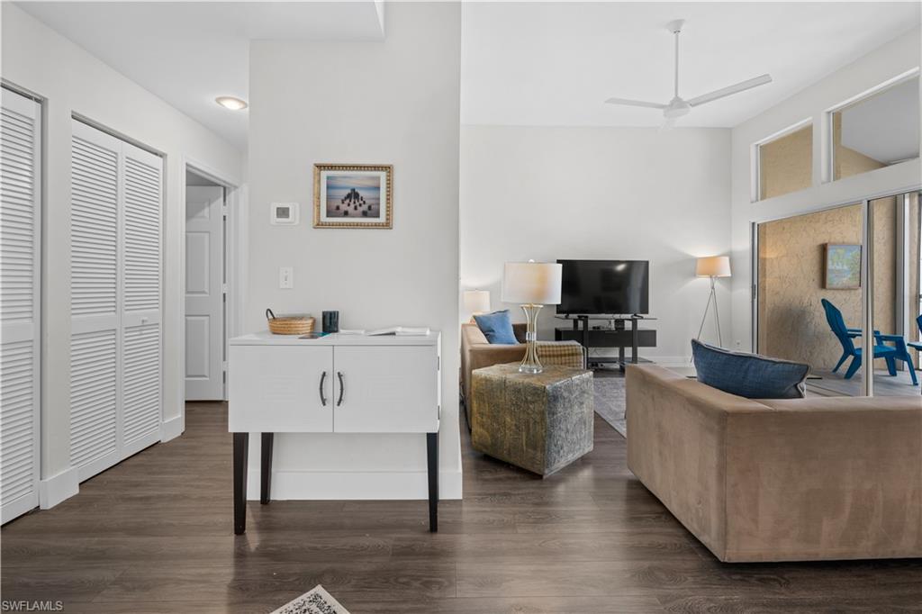 2711 Citrus Lake Drive, Unit F302 Naples, FL 34109 - Photo 13 of 20 a living room with furniture and a flat screen tv