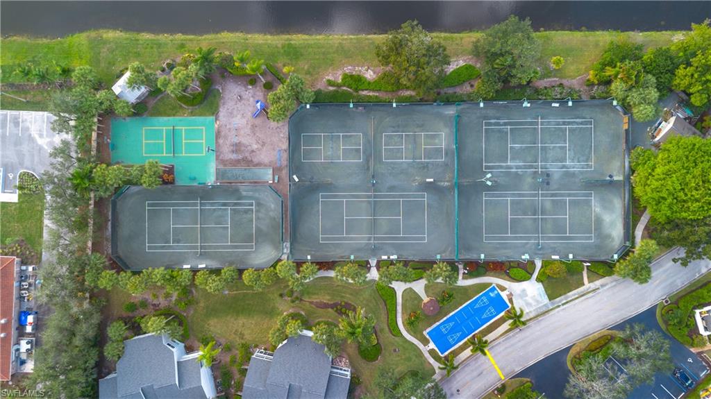 2711 Citrus Lake Drive, Unit F302 Naples, FL 34109 - Photo 18 of 20 a small pool with outdoor seating area