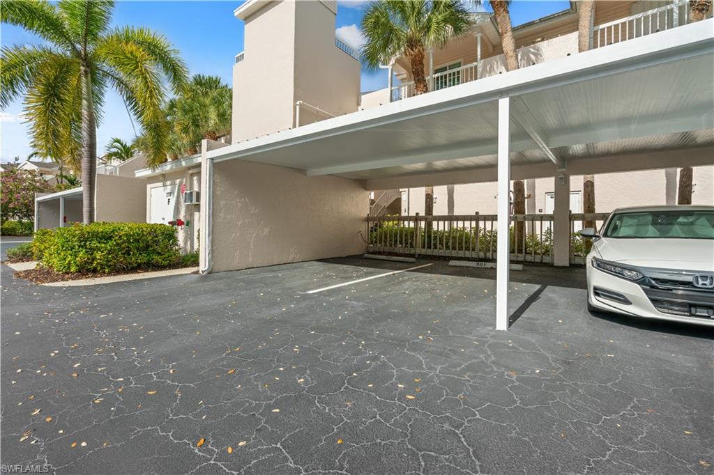 2711 Citrus Lake Drive, Unit F302 Naples, FL 34109 - Photo 20 of 20 a view of car parked in front of house