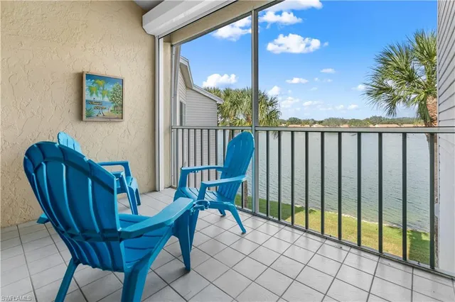 a view of a balcony with furniture