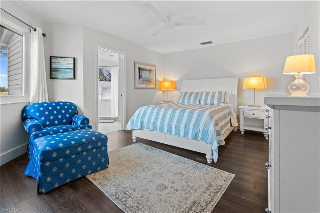 2711 Citrus Lake Drive, Unit F302 Naples, FL 34109 - Photo 5 of 20 a bedroom with a bed window and a couch