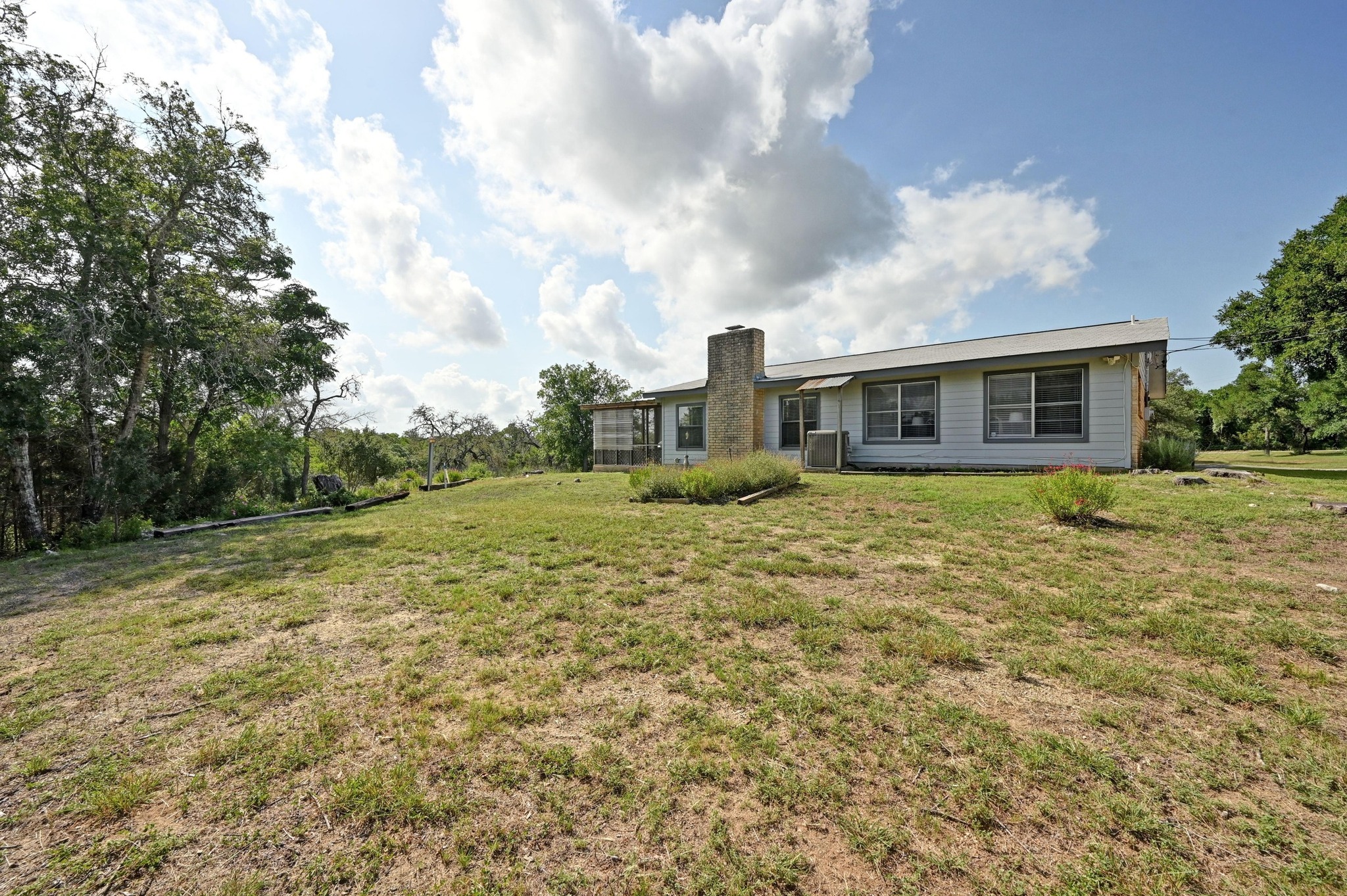 2018 Chaparral Park Road Manchaca, TX 78652 - Photo 23 of 26 a view of house with yard and sitting area