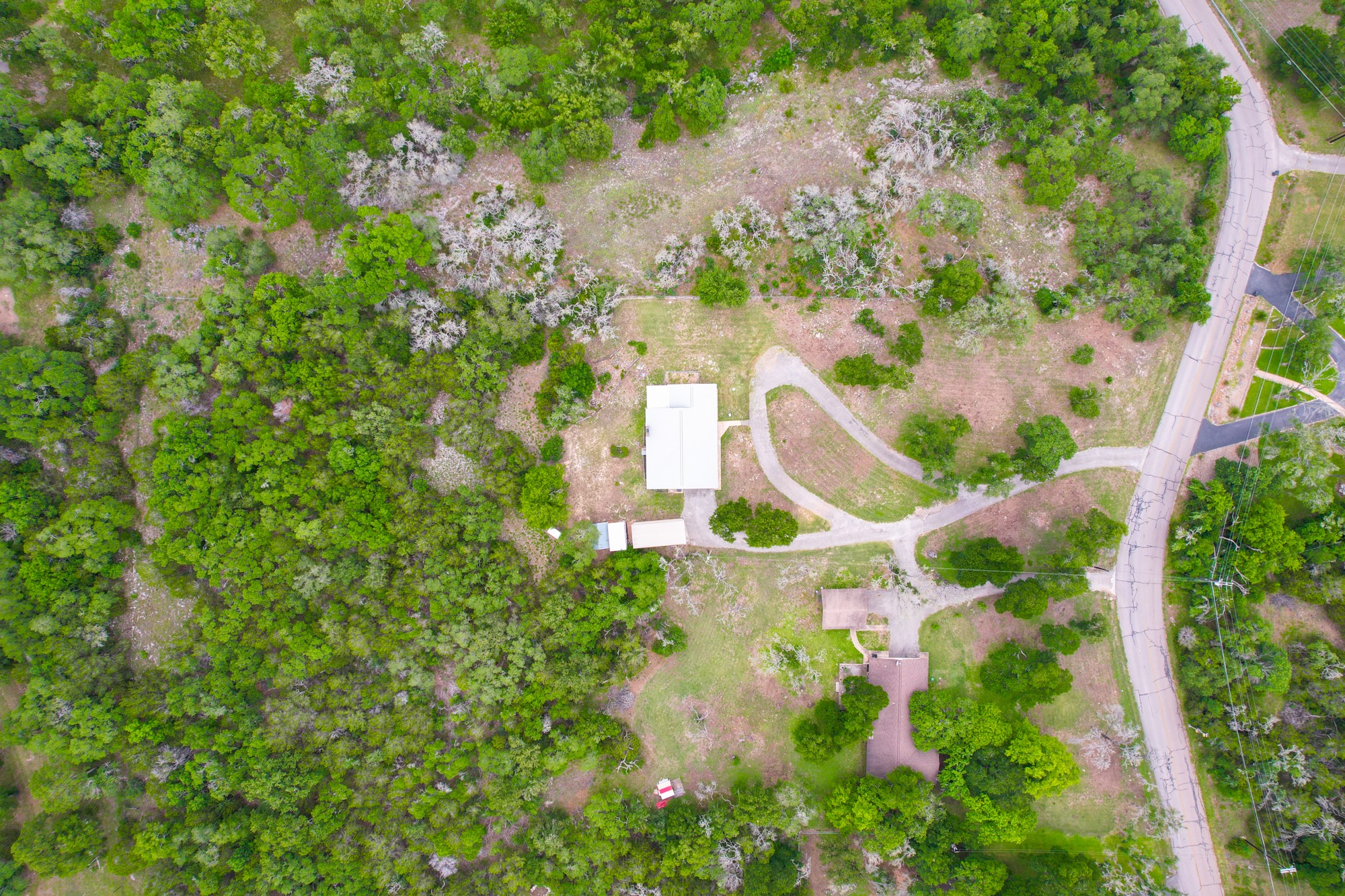 2018 Chaparral Park Road Manchaca, TX 78652 - Photo 26 of 26 an aerial view of residential house with outdoor space and trees all around