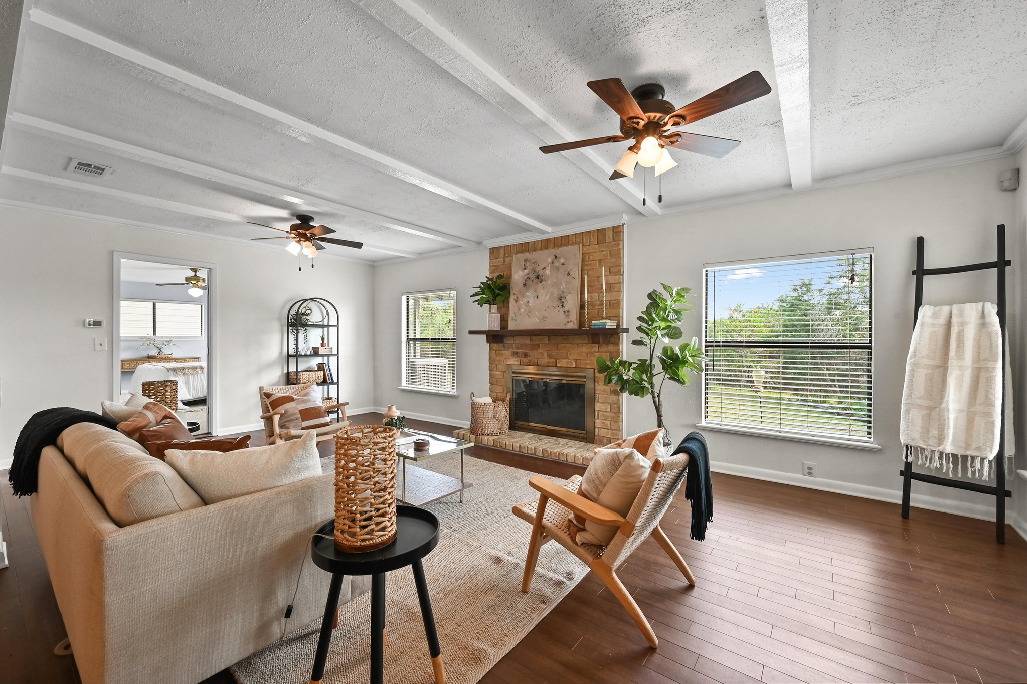 2018 Chaparral Park Road Manchaca, TX 78652 - Photo 6 of 26 a living room with furniture a fireplace and a floor to ceiling window