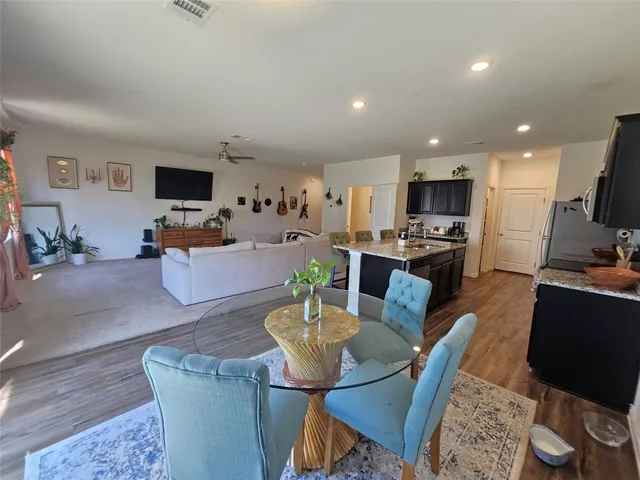 a living room with fireplace furniture and a flat screen tv