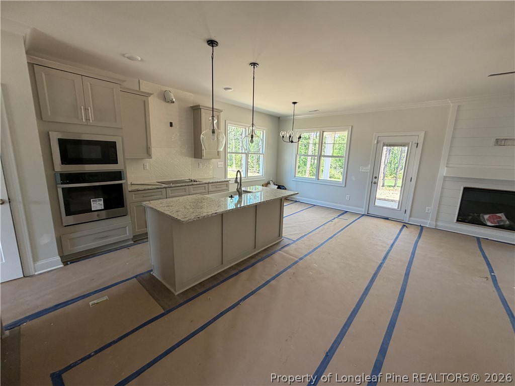 930 Rhum Drive Fayetteville, NC 28311 - Photo 12 of 49 a spacious kitchen with stainless steel appliances granite countertop a sink and a refrigerator