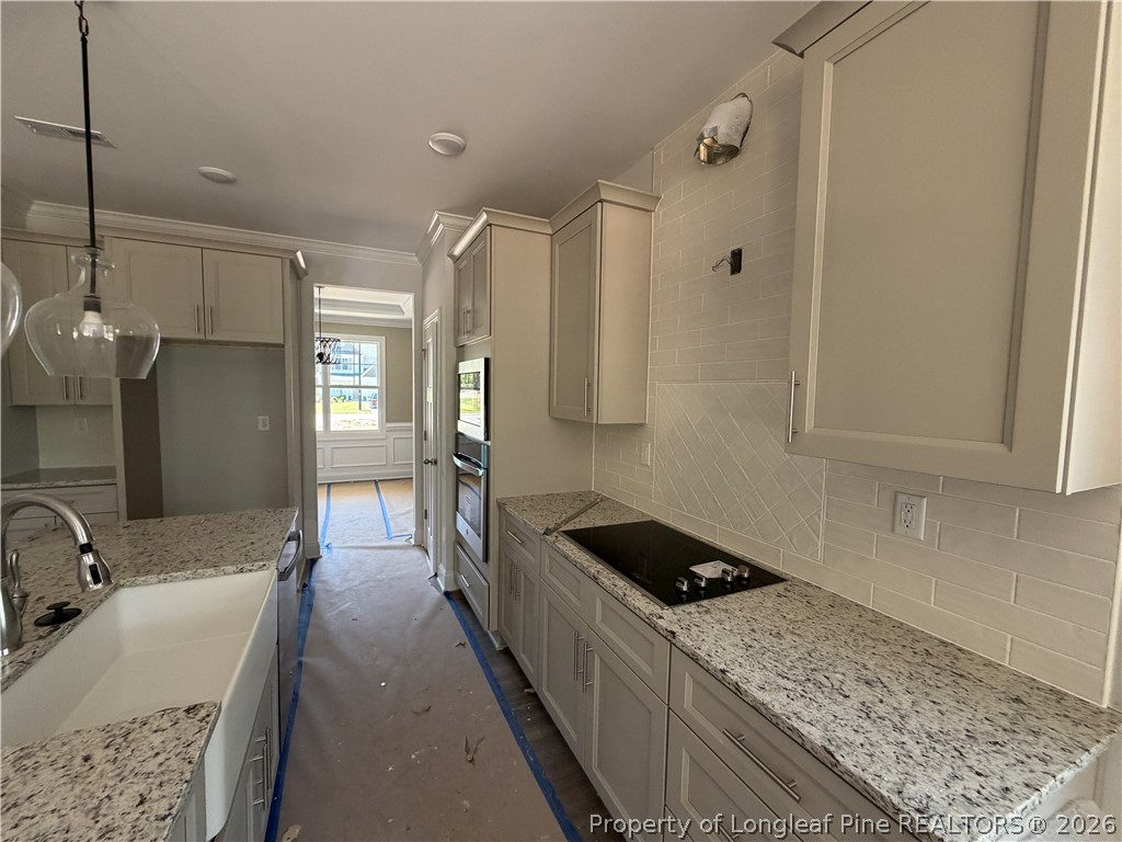 930 Rhum Drive Fayetteville, NC 28311 - Photo 20 of 49 a kitchen with a sink stove and cabinets