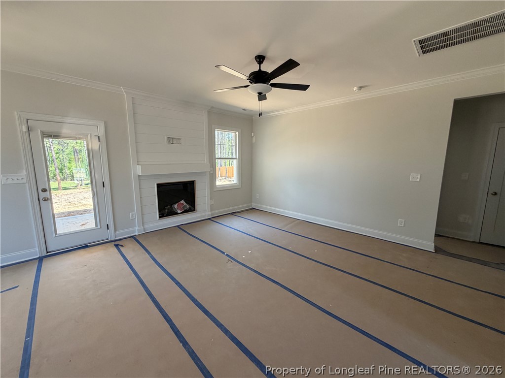 930 Rhum Drive Fayetteville, NC 28311 - Photo 22 of 49 an empty room with windows and fireplace
