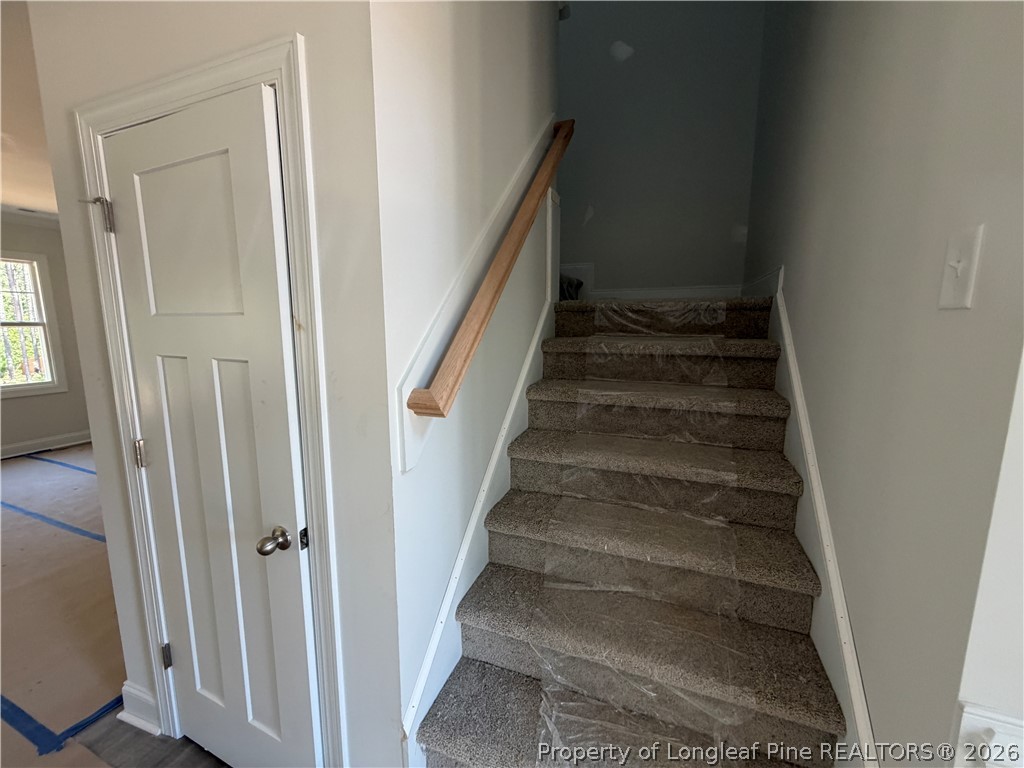 930 Rhum Drive Fayetteville, NC 28311 - Photo 35 of 49 a view of staircase with white walls and windows