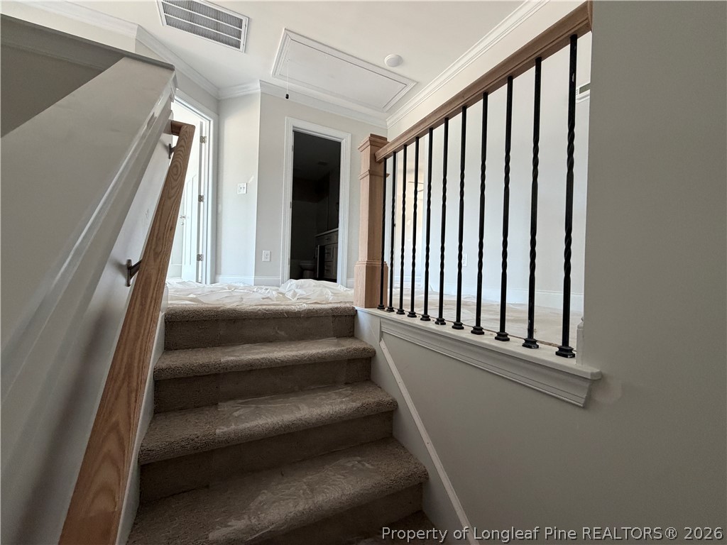 930 Rhum Drive Fayetteville, NC 28311 - Photo 36 of 49 a view of staircase with white walls and a window