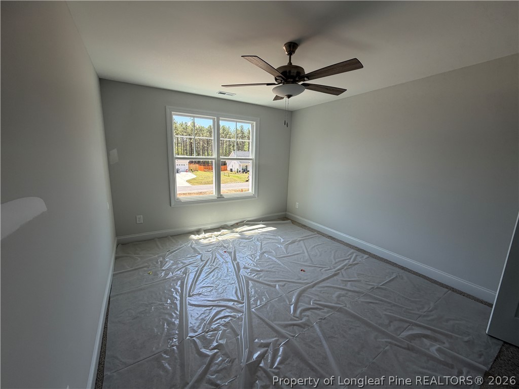 930 Rhum Drive Fayetteville, NC 28311 - Photo 39 of 49 an empty room with windows and fan