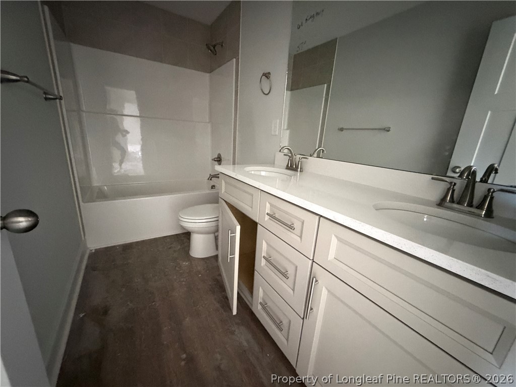 930 Rhum Drive Fayetteville, NC 28311 - Photo 40 of 49 a bathroom with a double vanity sink and a mirror