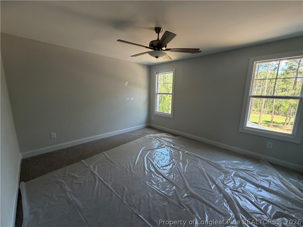 930 Rhum Drive Fayetteville, NC 28311 - Photo 41 of 49 a view of an empty room with window and wooden floor
