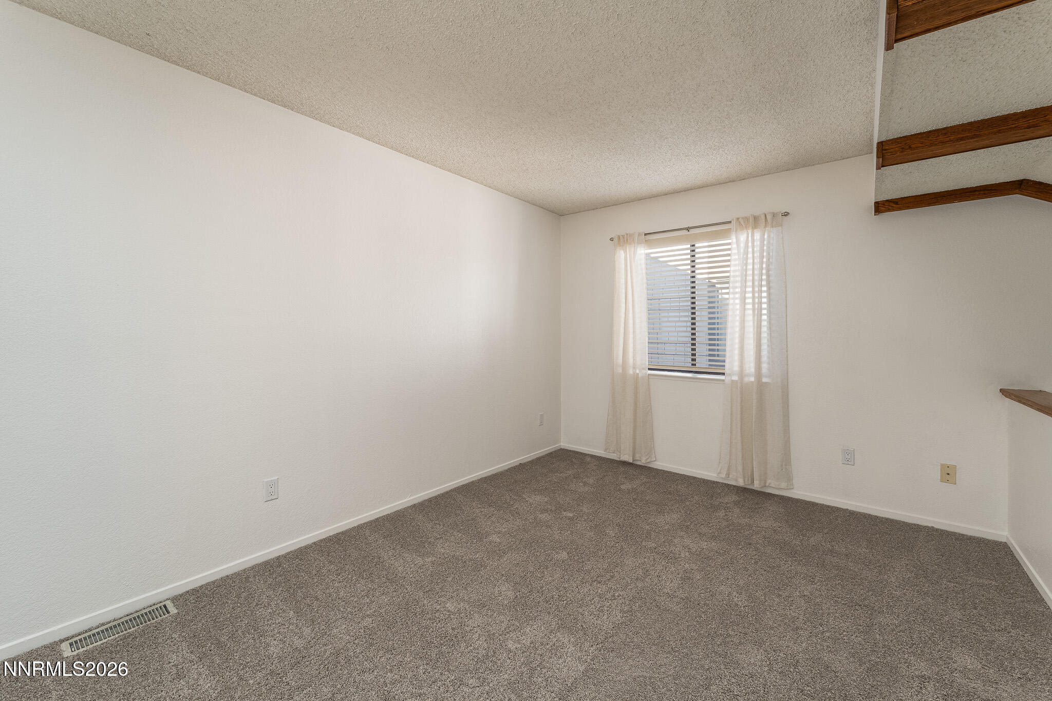 1465 East Peckham Lane, Unit 6 Reno, NV 89502 - Photo 14 of 25 an empty room with windows