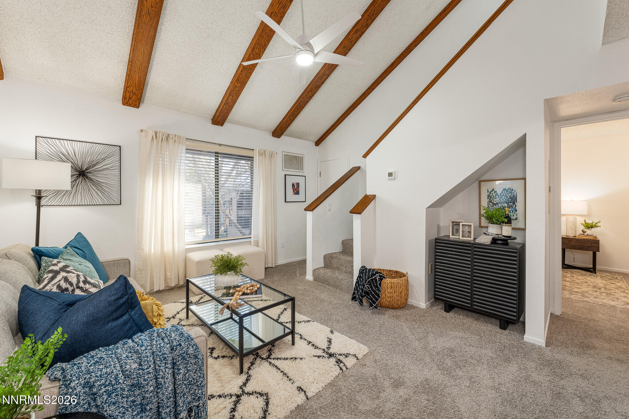 1465 East Peckham Lane, Unit 6 Reno, NV 89502 - Photo 2 of 25 a living room with furniture and a window