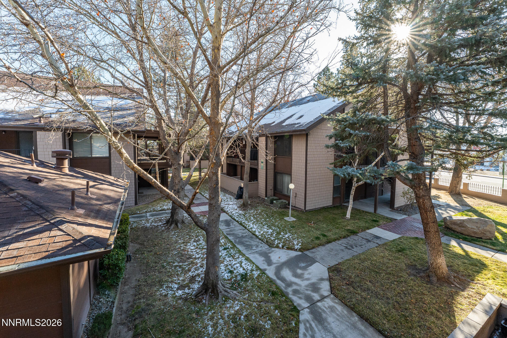 1465 East Peckham Lane, Unit 6 Reno, NV 89502 - Photo 21 of 25 front view of a house with a yard
