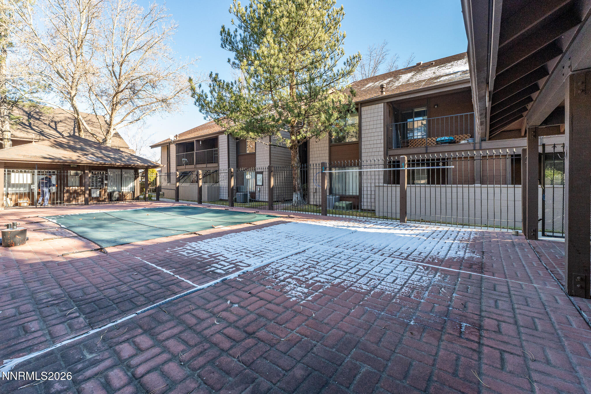 1465 East Peckham Lane, Unit 6 Reno, NV 89502 - Photo 22 of 25 a front view of a house with a yard