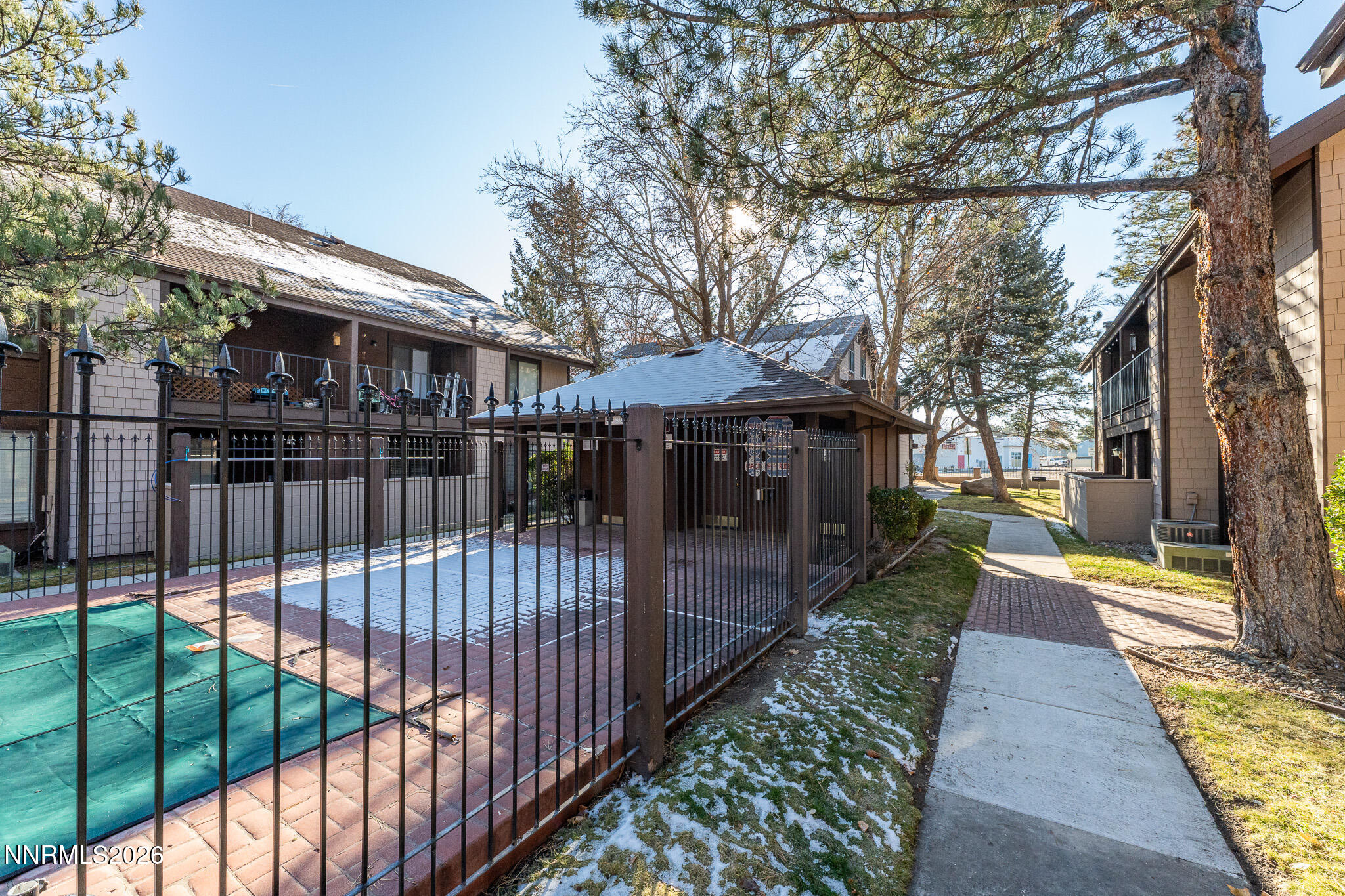 1465 East Peckham Lane, Unit 6 Reno, NV 89502 - Photo 24 of 25 a view of a house with backyard and sitting area