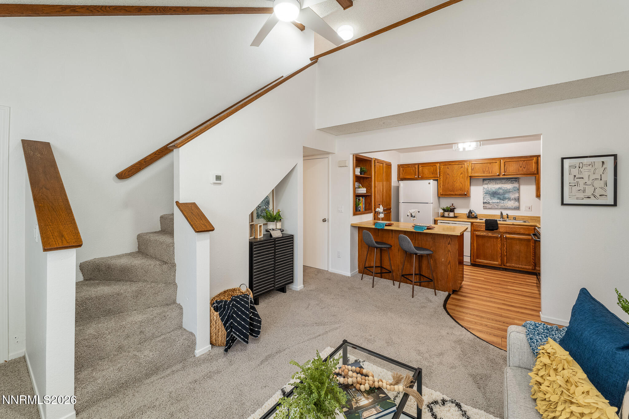 1465 East Peckham Lane, Unit 6 Reno, NV 89502 - Photo 3 of 25 a living room with furniture and a floor to ceiling window