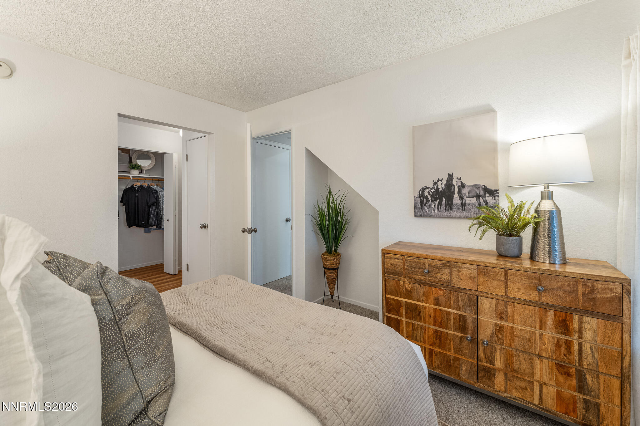1465 East Peckham Lane, Unit 6 Reno, NV 89502 - Photo 9 of 25 a bedroom with a bed and a dresser