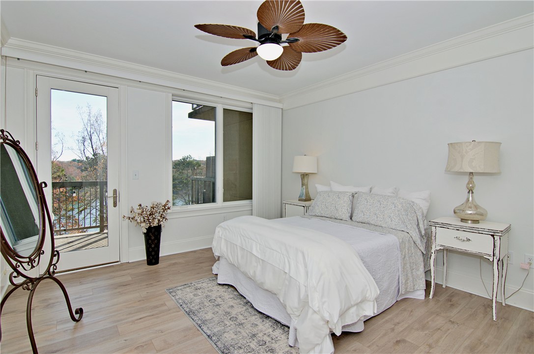 601 Watermarke Lane Anderson, SC 29625 - Photo 8 of 25 This serene bedroom offers a private balcony and picturesque views, perfect for peaceful mornings.