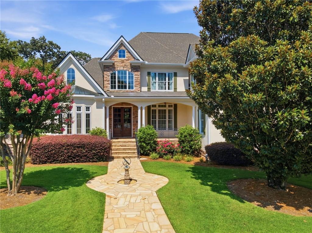 5 St Andrews Way Rome, GA 30165 - Photo 1 of 75 a front view of a house with a garden and plants