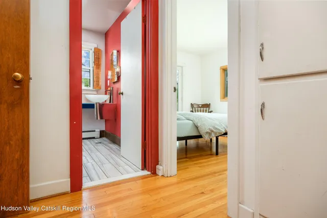 a view of a bathroom from a hallway