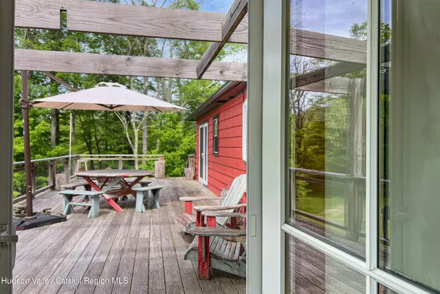 a view of a chairs and table on the deck