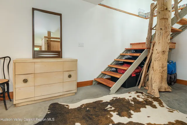 a living room with furniture and a rug