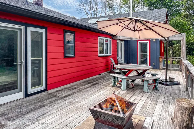 a view of a chairs and table in the patio