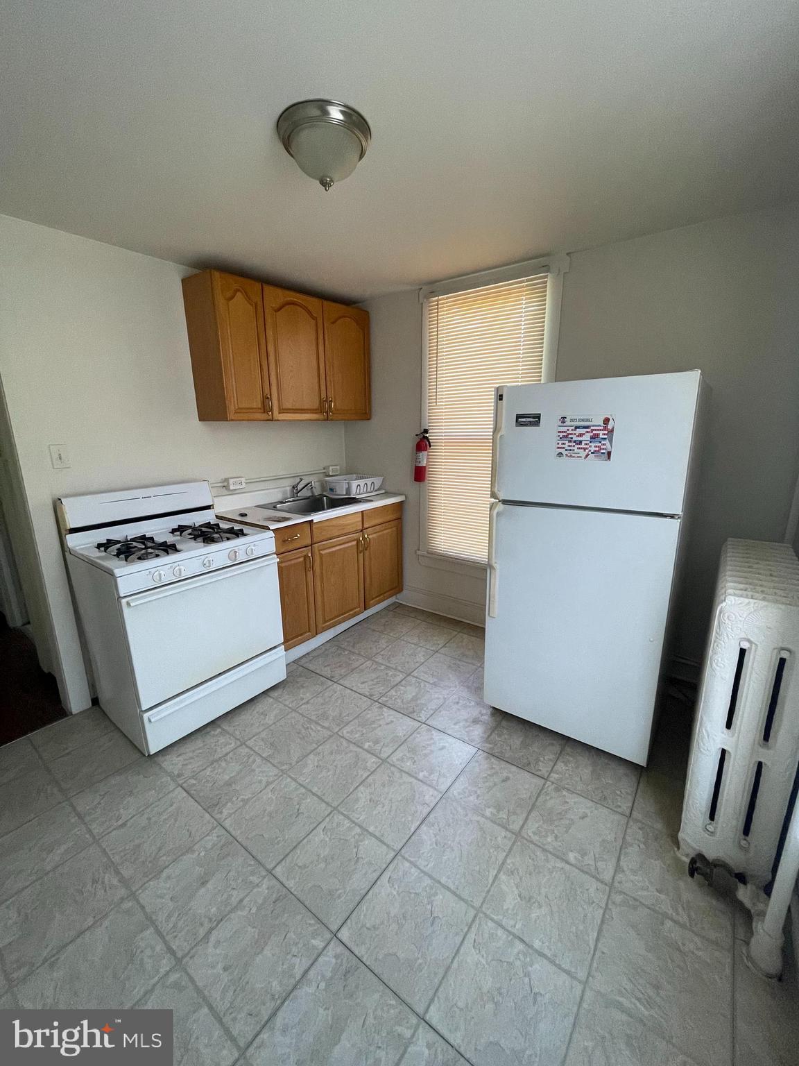 13 Kirkwood Road, Unit 2B Gibbsboro, NJ 08026 - Photo 2 of 9 a kitchen with a stove a sink and a refrigerator
