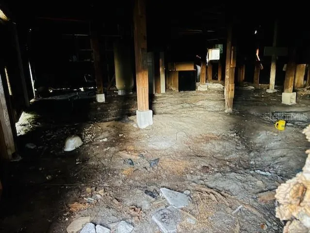 a view of a house with a yard and a tree