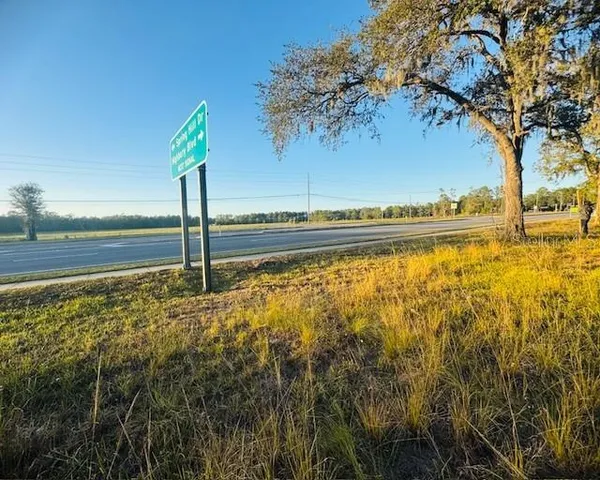 a view of a water pond with an outdoor seating