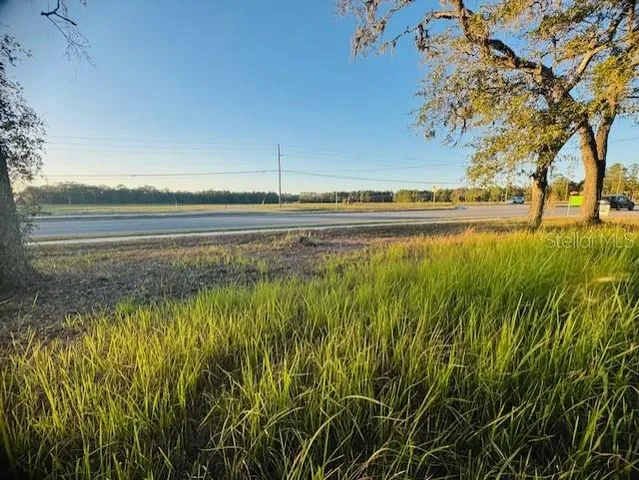 a view of a lake with a big yard